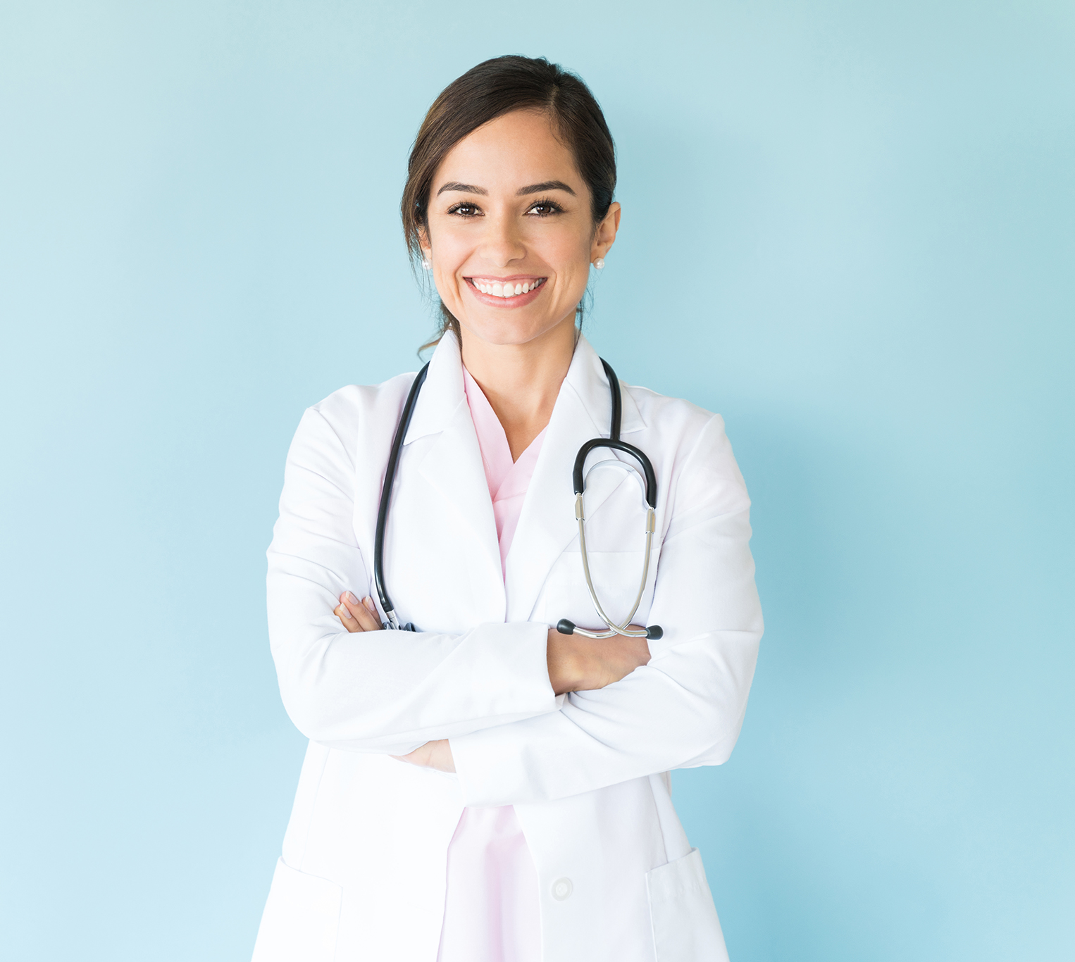 Smiling,Female,Doctor,In,Lab,Coat,With,Arms,Crossed,Against